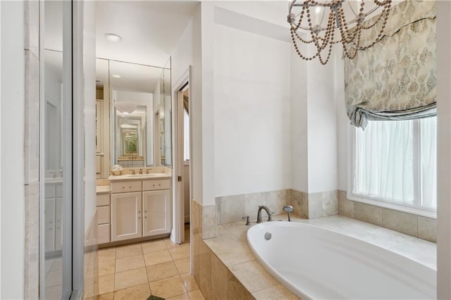 450 Fairway Dr, New Orleans, LA 70124 - full bath featuring vanity, a garden tub, tile patterned floors, and a chandelier