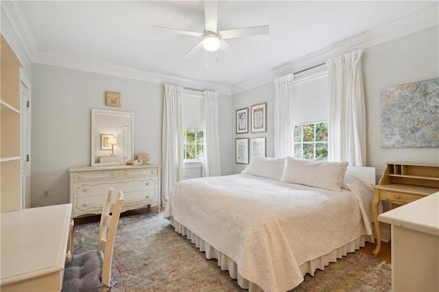 450 Fairway Dr, New Orleans, LA 70124 - bedroom with multiple windows, crown molding, wood finished floors, and a ceiling fan