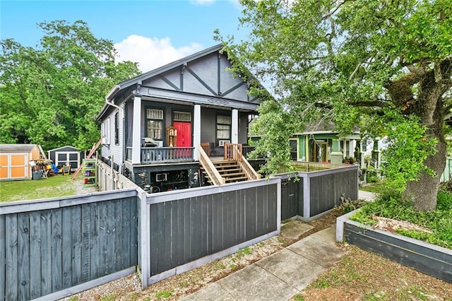 1421 Kentucky St, New Orleans, LA 70117 - view of front facade featuring a shed, a porch, and stairs