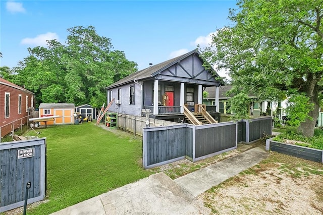 1421 Kentucky St, New Orleans, LA 70117 - view of front facade featuring a shed, stairs, and a porch