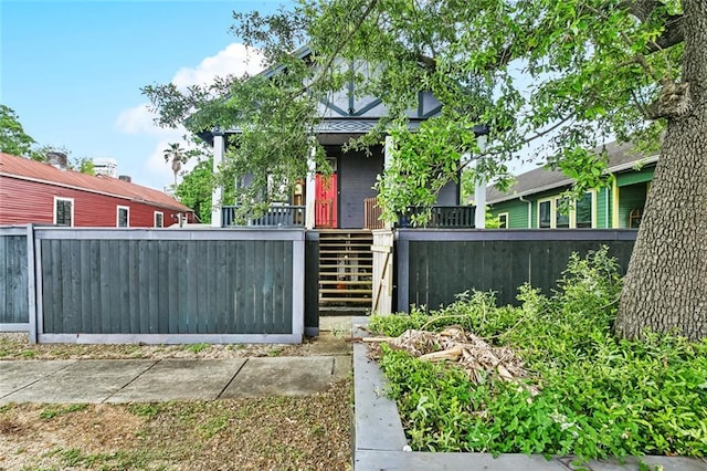 1421 Kentucky St, New Orleans, LA 70117 - view of front of house featuring stairway and covered porch