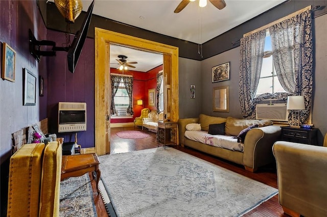 1421 Kentucky St, New Orleans, LA 70117 - living room with heating unit, ceiling fan, wood finished floors, and cooling unit