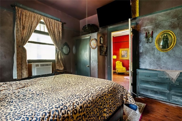 1421 Kentucky St, New Orleans, LA 70117 - bedroom with cooling unit and wood finished floors
