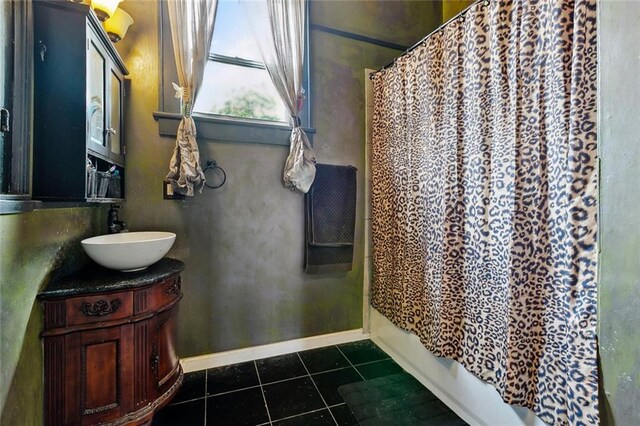 1421 Kentucky St, New Orleans, LA 70117 - full bathroom with vanity, tile patterned flooring, and shower / bath combination with curtain
