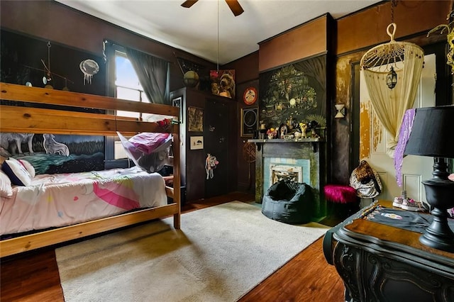 1421 Kentucky St, New Orleans, LA 70117 - bedroom featuring wood finished floors, a fireplace with flush hearth, and ceiling fan