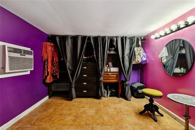 1421 Kentucky St, New Orleans, LA 70117 - bedroom with baseboards and a wall mounted air conditioner