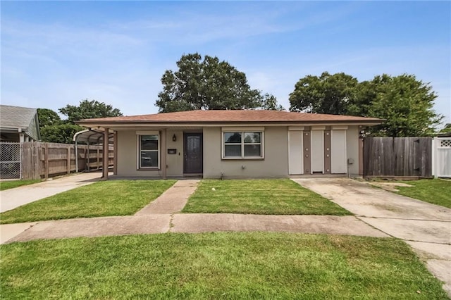624 Taylorbrook St, Gretna, LA 70053 - view of front of property with concrete driveway and stucco siding