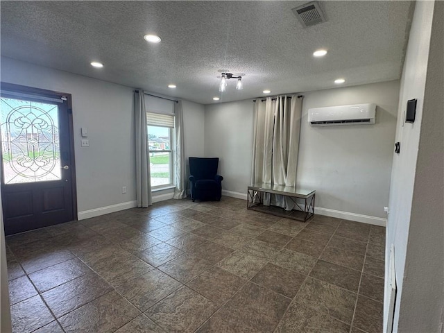 624 Taylorbrook St, Gretna, LA 70053 - foyer entrance featuring an AC wall unit, recessed lighting, and a textured ceiling