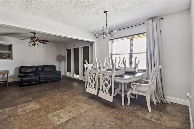 624 Taylorbrook St, Gretna, LA 70053 - dining room with a chandelier, a textured ceiling, and ceiling fan