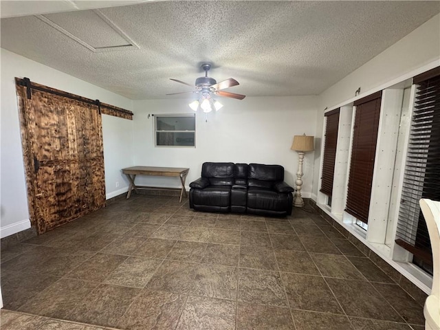 624 Taylorbrook St, Gretna, LA 70053 - sitting room featuring a ceiling fan, a barn door, and a textured ceiling