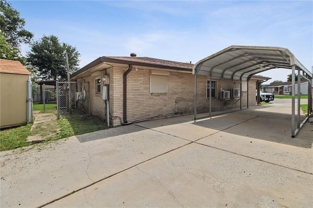 624 Taylorbrook St, Gretna, LA 70053 - exterior space featuring driveway, brick siding, and a carport