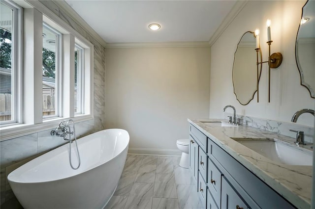 5613 Morton St, Metairie, LA 70003 - full bath featuring a freestanding bath, double vanity, crown molding, and marble finish flooring
