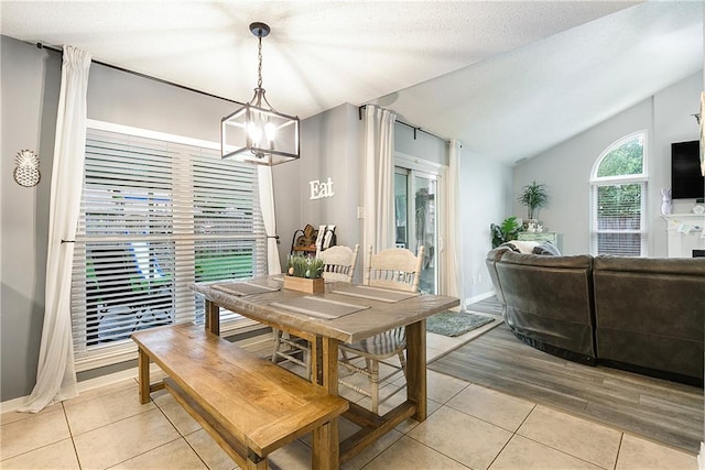 1927 Wyndemere Dr, Slidell, LA 70461 - dining space featuring light tile patterned floors, a chandelier, and lofted ceiling