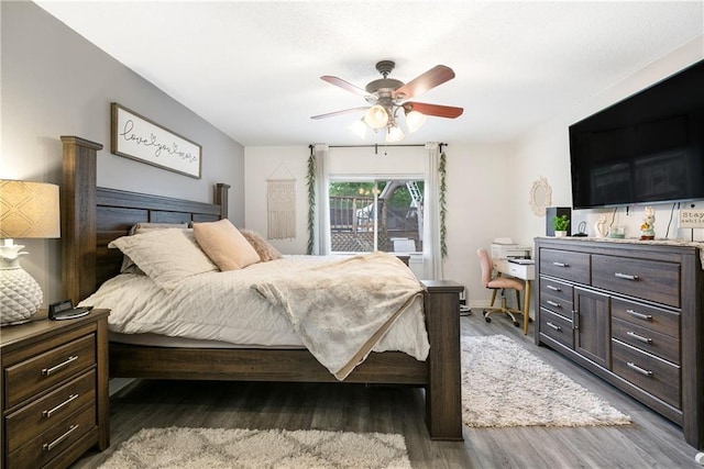 1927 Wyndemere Dr, Slidell, LA 70461 - bedroom featuring wood finished floors, a desk, and a ceiling fan