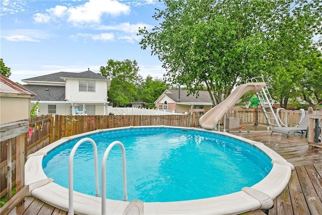 1927 Wyndemere Dr, Slidell, LA 70461 - view of pool featuring a deck, a fenced backyard, and a water slide