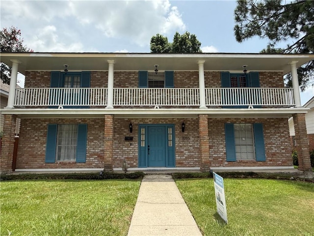 3757 Mimosa Ct, New Orleans, LA 70131 - view of front of house with a balcony, covered porch, and a front yard