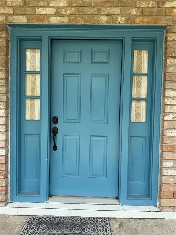 3757 Mimosa Ct, New Orleans, LA 70131 - view of exterior entry featuring brick siding