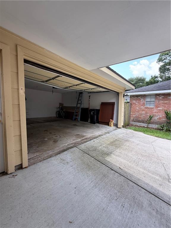 3757 Mimosa Ct, New Orleans, LA 70131 - garage featuring concrete driveway