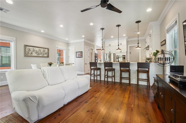 819 Franklin Ave, New Orleans, LA 70117 - living room featuring a ceiling fan, dark wood-style flooring, recessed lighting, and crown molding