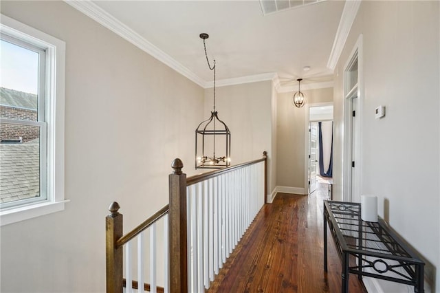 819 Franklin Ave, New Orleans, LA 70117 - hall featuring an upstairs landing, dark wood finished floors, crown molding, and a chandelier