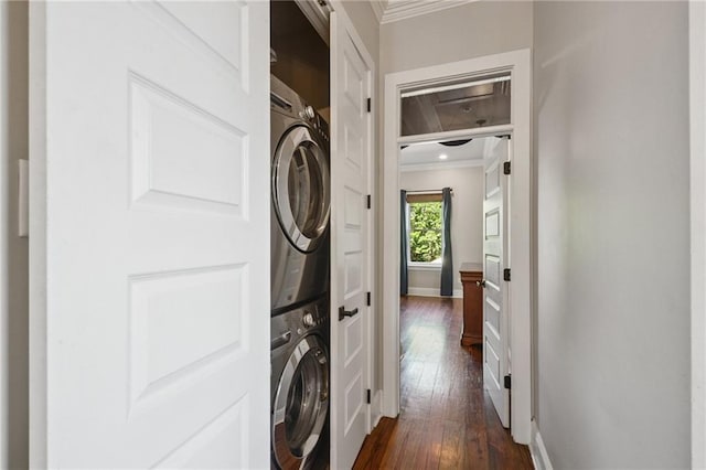 819 Franklin Ave, New Orleans, LA 70117 - laundry room with stacked washer / dryer, crown molding, and dark wood-type flooring