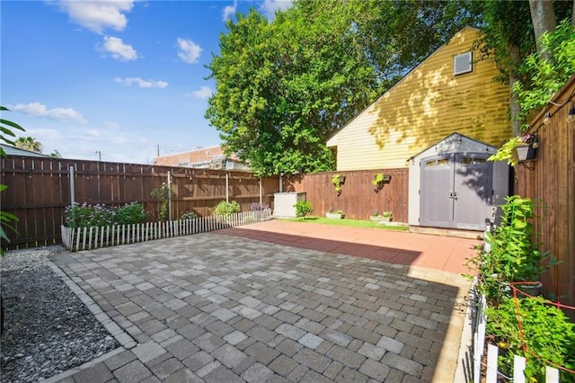 819 Franklin Ave, New Orleans, LA 70117 - fenced backyard featuring a patio and a storage shed