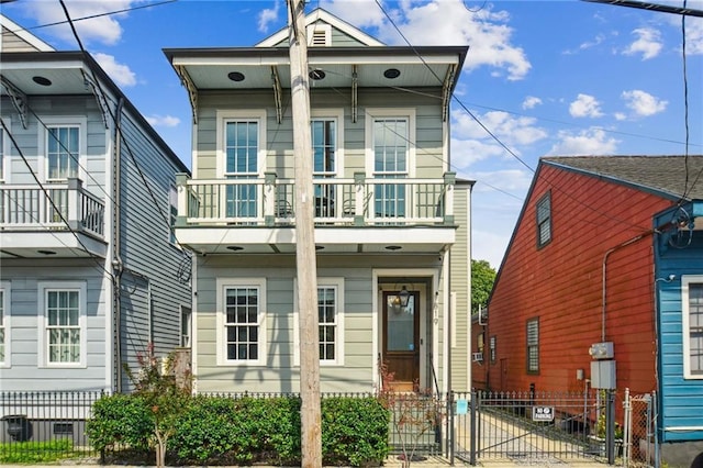819 Franklin Ave, New Orleans, LA 70117 - shotgun-style home featuring a balcony and a gate