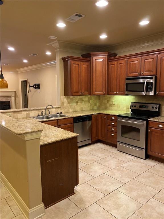 11110 Boardwalk Dr Unit 41, Baton Rouge, LA 70816 - kitchen with appliances with stainless steel finishes, ornamental molding, a peninsula, backsplash, and light stone counters