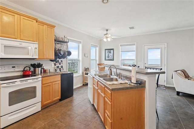 271 Lakeview Dr, Slidell, LA 70458 - kitchen featuring white appliances, ornamental molding, a center island with sink, a ceiling fan, and dark countertops