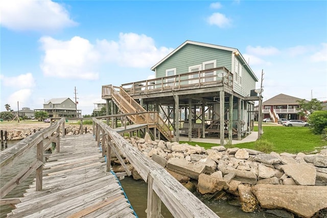 271 Lakeview Dr, Slidell, LA 70458 - dock area with stairway, a wooden deck, and a yard