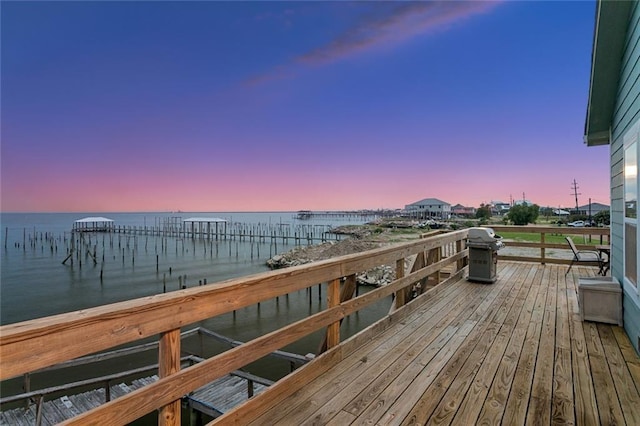 271 Lakeview Dr, Slidell, LA 70458 - deck at dusk featuring a grill and a water view