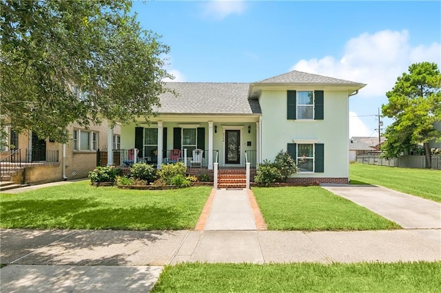 6744 Canal Blvd, New Orleans, LA 70124 - view of front facade featuring a porch, a front lawn, stucco siding, and roof with shingles