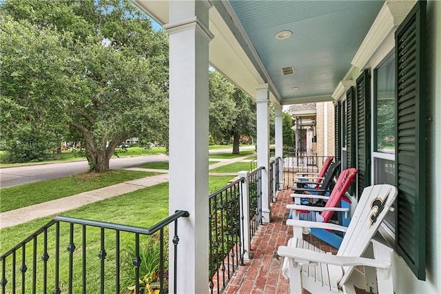 6744 Canal Blvd, New Orleans, LA 70124 - covered porch with a yard