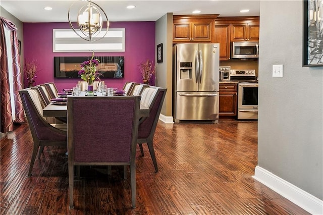 6744 Canal Blvd, New Orleans, LA 70124 - dining space featuring dark wood-style flooring, a chandelier, and recessed lighting