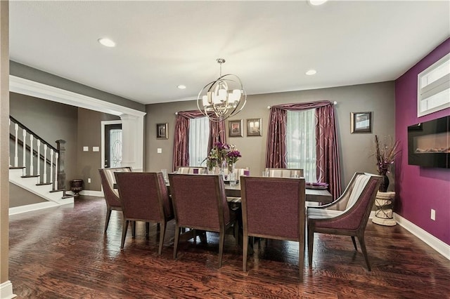 6744 Canal Blvd, New Orleans, LA 70124 - dining area featuring a chandelier, wood finished floors, recessed lighting, stairs, and ornate columns