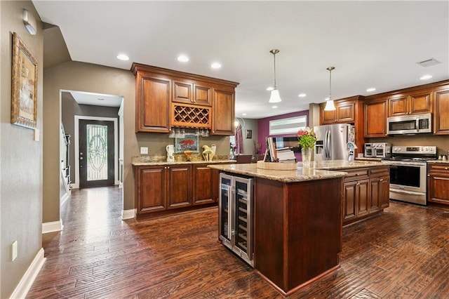 6744 Canal Blvd, New Orleans, LA 70124 - kitchen with stainless steel appliances, beverage cooler, dark wood-style floors, a center island, and light stone countertops