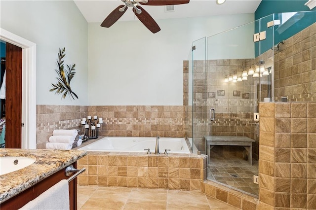6744 Canal Blvd, New Orleans, LA 70124 - full bathroom featuring a garden tub, vanity, a ceiling fan, and a stall shower