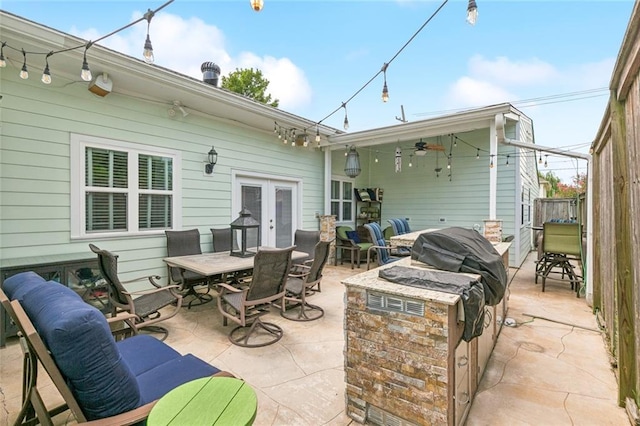 6744 Canal Blvd, New Orleans, LA 70124 - view of patio with outdoor dining area, a ceiling fan, and french doors