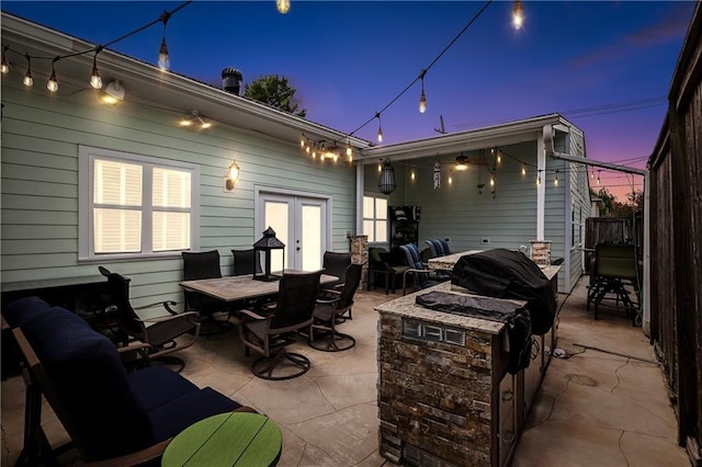 6744 Canal Blvd, New Orleans, LA 70124 - patio terrace at dusk with a patio area, outdoor dining area, and an outdoor living space with a fire pit