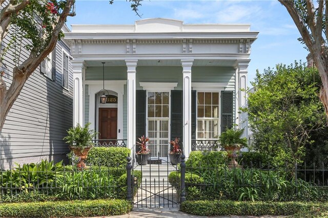 3325 Coliseum St, New Orleans, LA 70115 - property entrance with covered porch and a gate