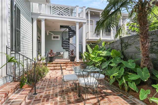3325 Coliseum St, New Orleans, LA 70115 - view of patio featuring stairway and outdoor dining area