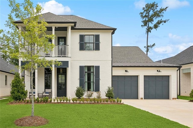1185 Delta Ln, Covington, LA 70433 - view of front of property with a balcony, a garage, driveway, a front yard, and roof with shingles