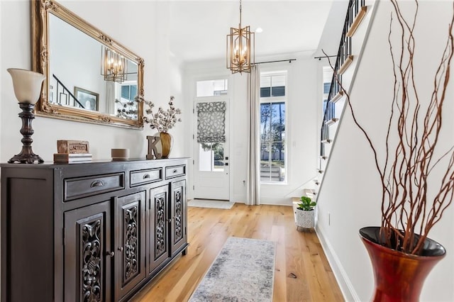 1185 Delta Ln, Covington, LA 70433 - entryway with a chandelier, stairway, light wood-style floors, and recessed lighting