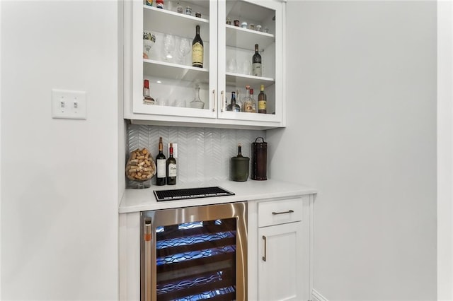 1185 Delta Ln, Covington, LA 70433 - indoor dry bar featuring beverage cooler and decorative backsplash