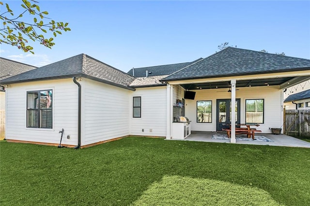1185 Delta Ln, Covington, LA 70433 - back of property with ceiling fan, a patio area, and a shingled roof