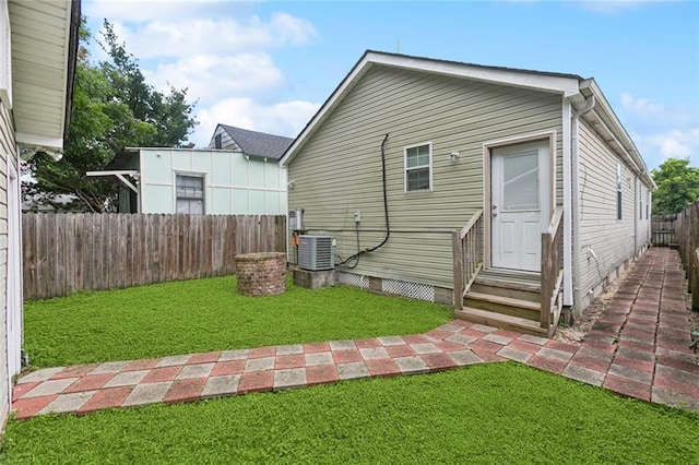 2517 Myrtle St, New Orleans, LA 70122 - rear view of house featuring a fenced backyard, entry steps, and crawl space