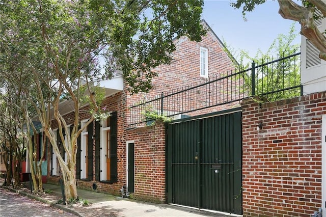 1124 Barracks St, New Orleans, LA 70116 - view of side of property with brick siding