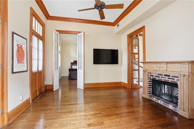 1124 Barracks St, New Orleans, LA 70116 - unfurnished living room with ornamental molding, wood finished floors, a ceiling fan, and a brick fireplace