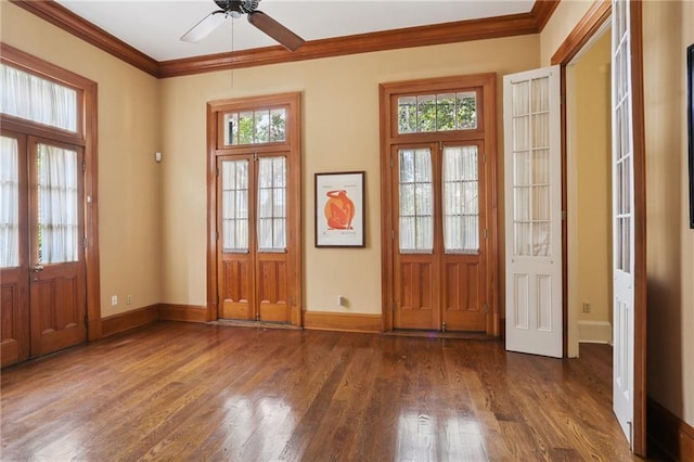 1124 Barracks St, New Orleans, LA 70116 - foyer entrance with ornamental molding, dark wood finished floors, and ceiling fan