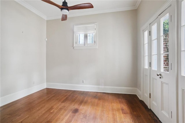 1124 Barracks St, New Orleans, LA 70116 - spare room featuring wood finished floors, plenty of natural light, crown molding, and ceiling fan